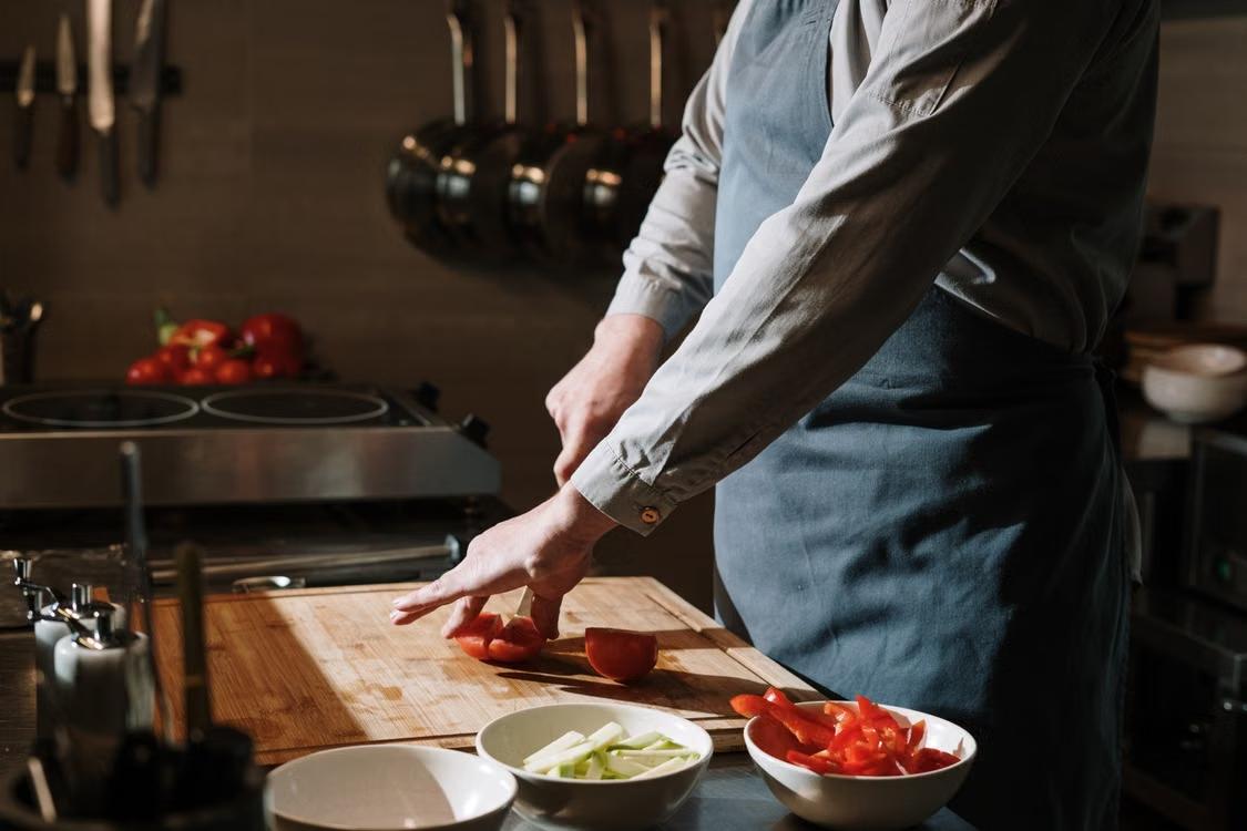 Home cook using professional chef knives for everyday meal preparation